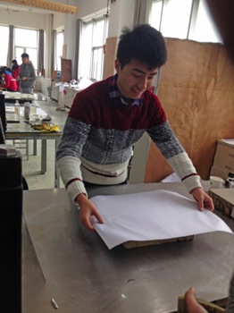 Placing paper on top of the stone